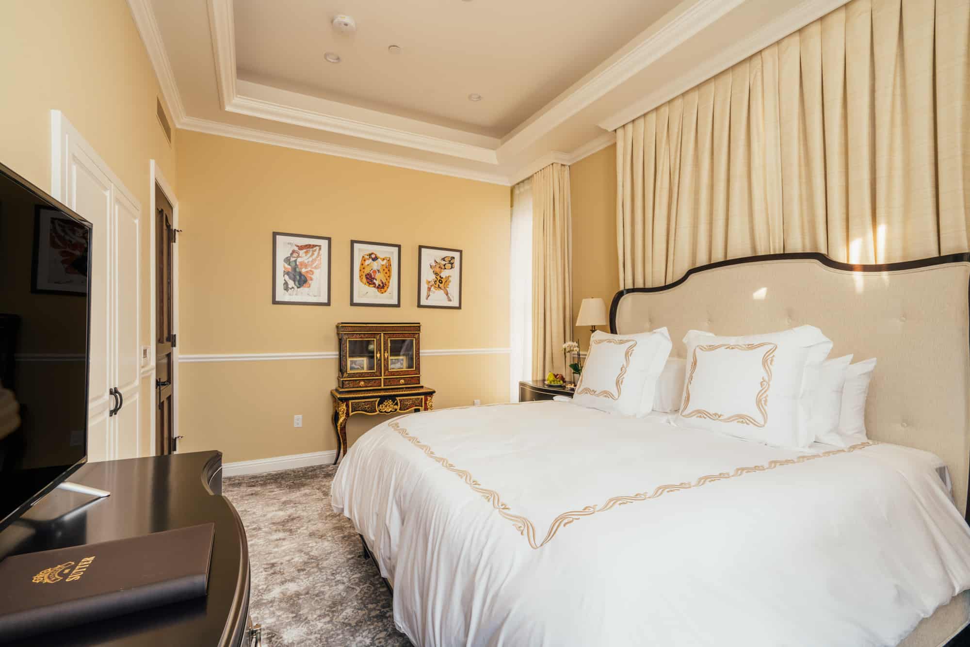 The Corner Suite - carpeted bedroom, proper closet, an Eastern King bed, bathroom has a shower and separate soaking tub.